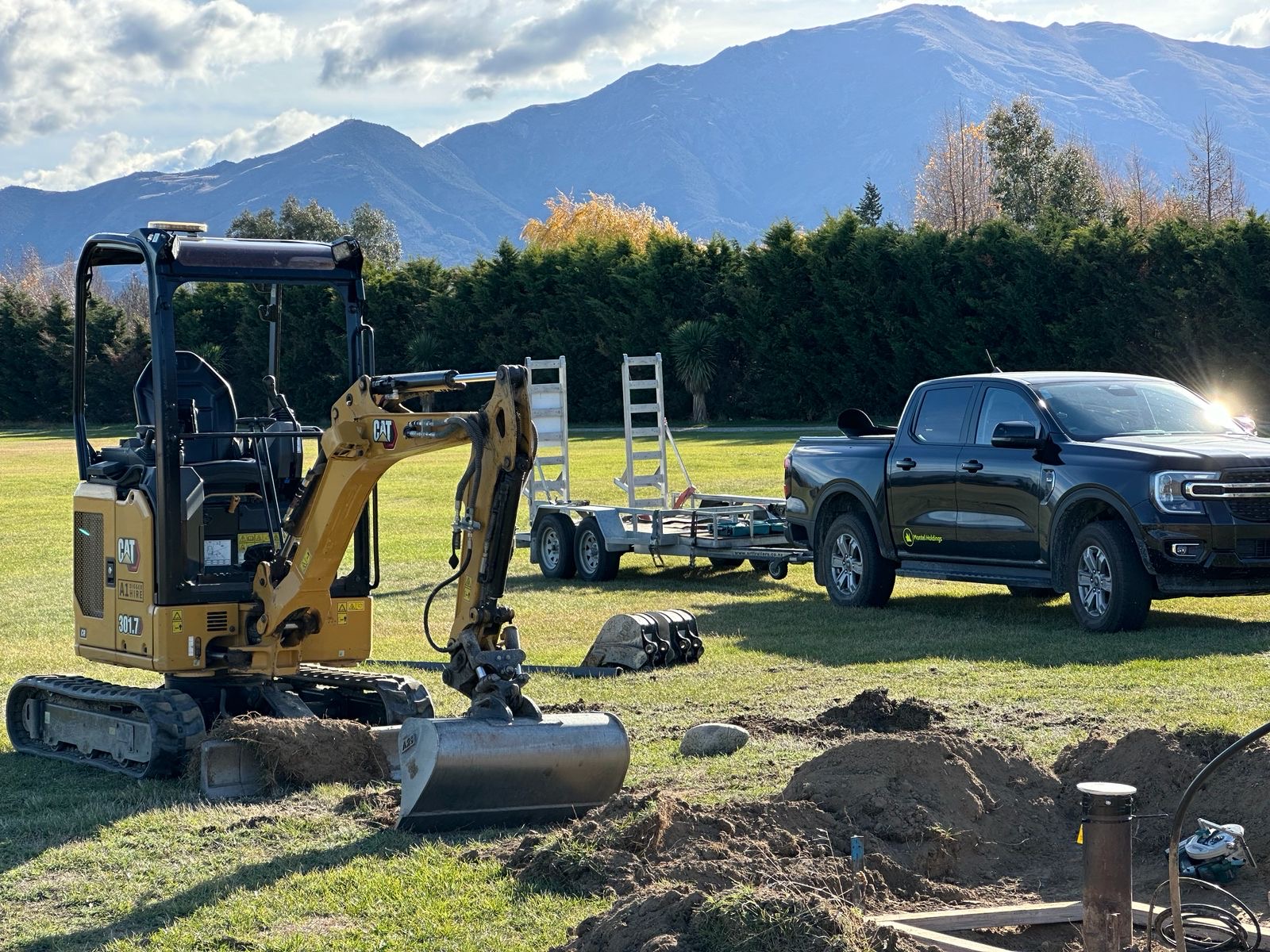 A1 Equipment Hire excavator and transport trailer on site